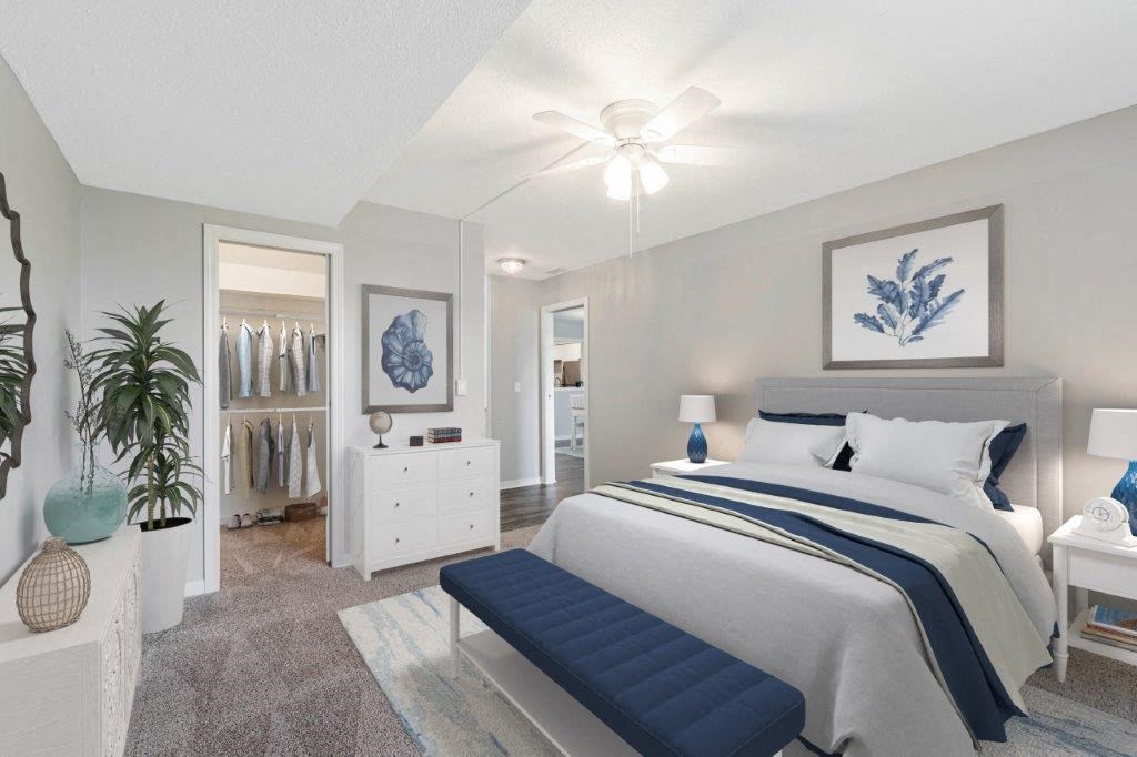 a bedroom with a bed and a closet