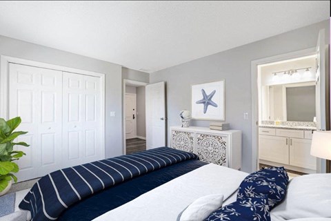 a bedroom with a large bed and a mirror