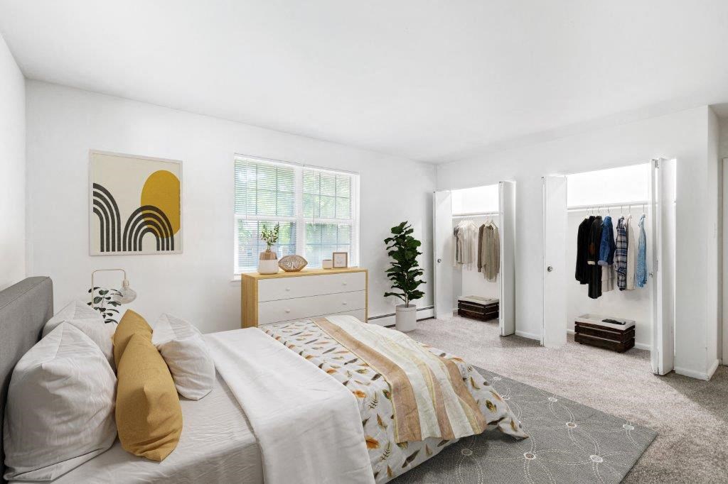 a bedroom with a bed and a closet