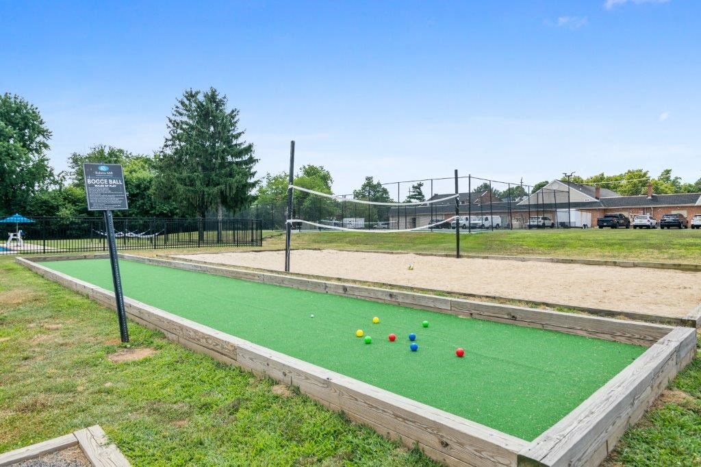 the park has a tennis court with balls on it