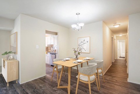 a dining room with a table and chairs