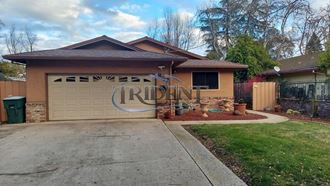 a house with a driveway and a garage door