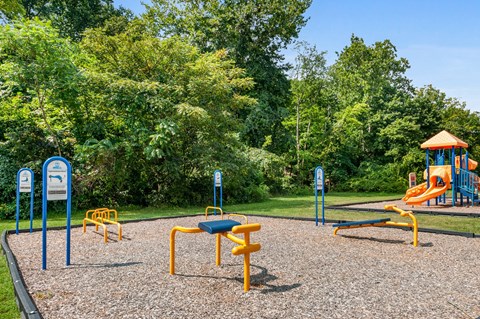 a playground with a swing set and other playground equipment