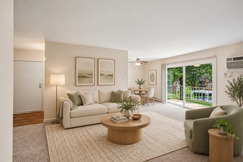 A living room with a couch, chair, and coffee table.