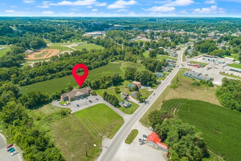 an aerial view of a neighborhood with a location pinpointed on top of a map
