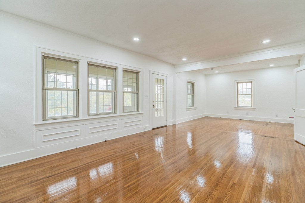 A room with wooden floors and white walls.