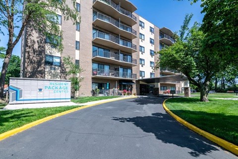 an empty street in front of an apartment building
