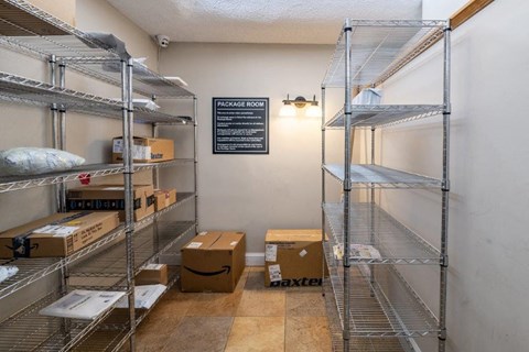 a room filled with boxes and wire shelves