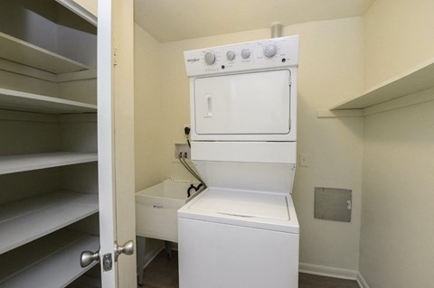 A white oven and dishwasher in a small kitchen.