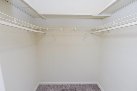 A room with white walls and a carpeted floor.