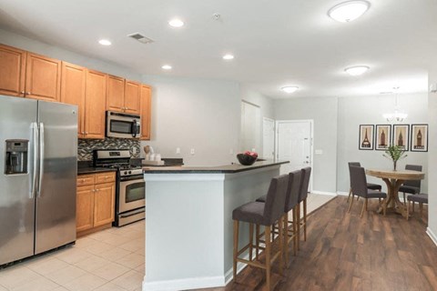 a kitchen with a counter top and a refrigerator
