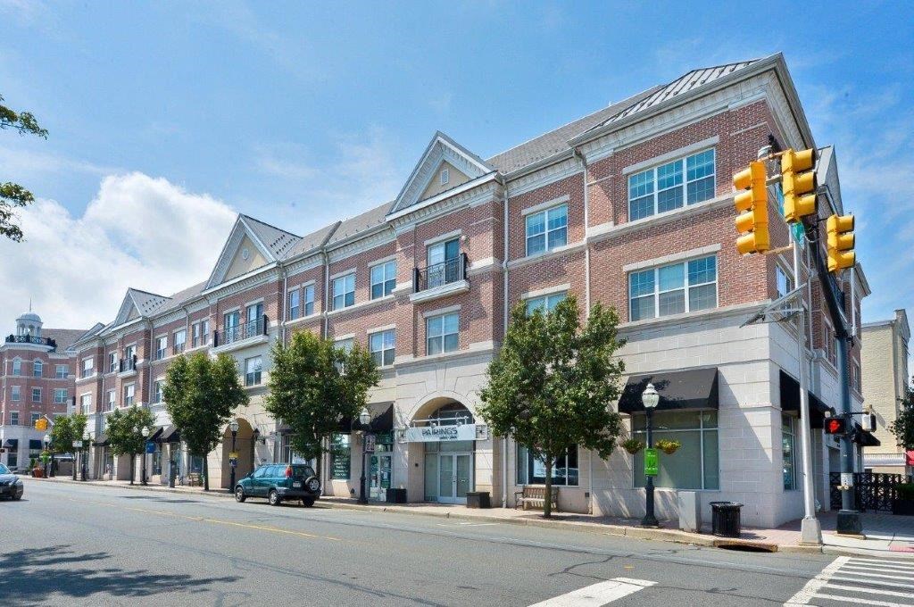 a large brick building on the corner of a city street