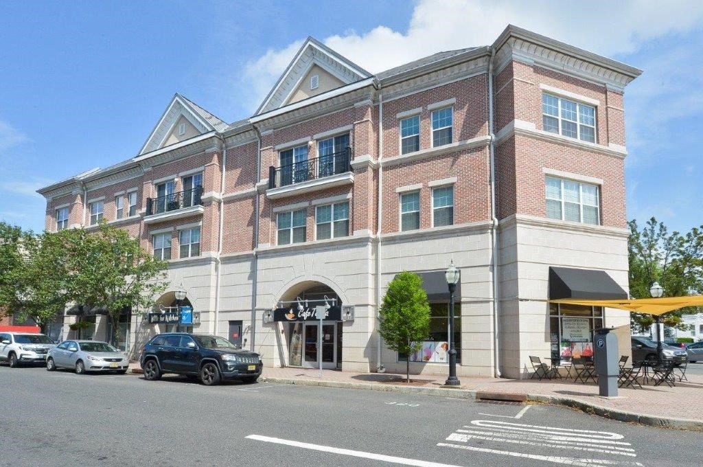 a large brick building on the side of a street