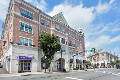 a large brick building on the corner of a street