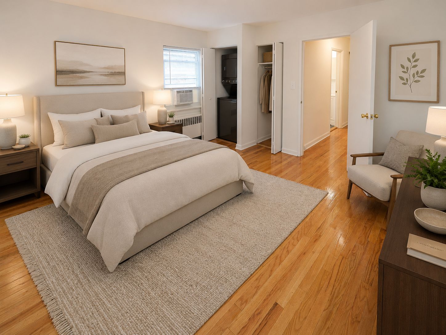 A bedroom with a large bed and a chair.
