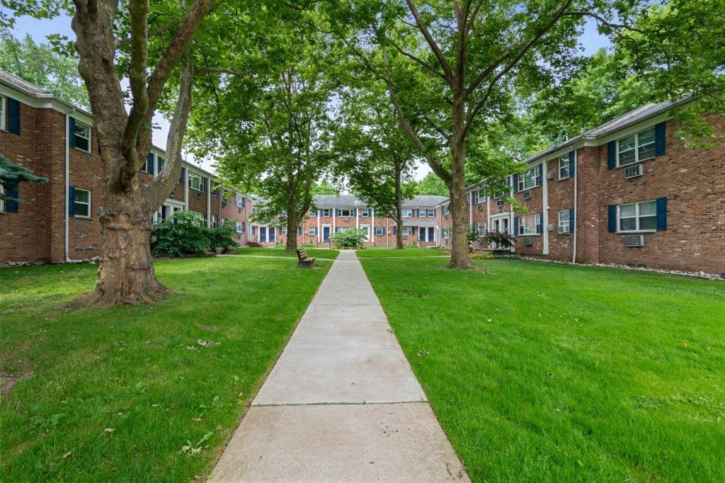 our apartments are located in a quiet neighborhood with green grass and trees
