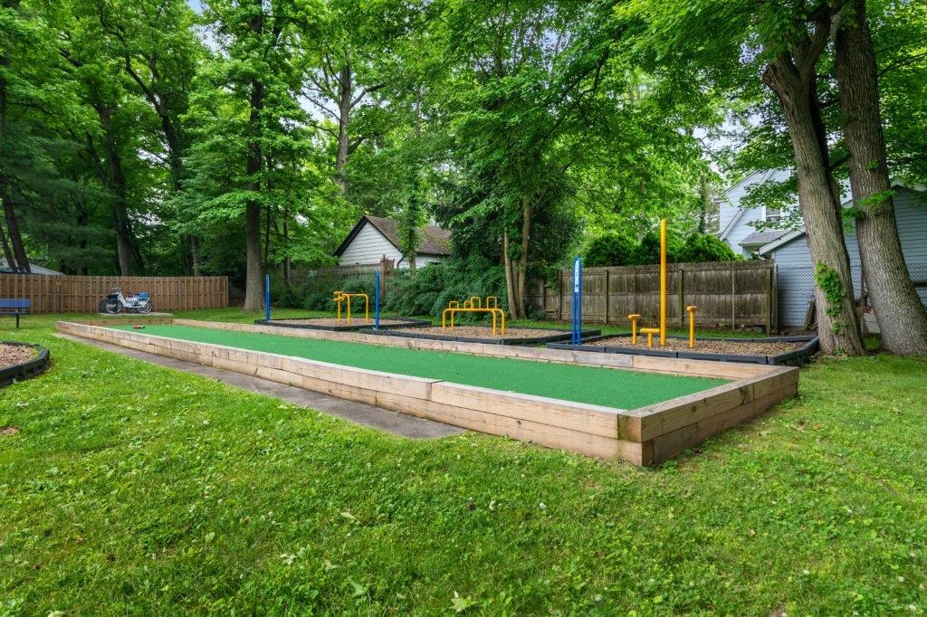 a childrens play area in the backyard of a house