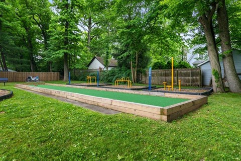 a childrens play area in the backyard of a house