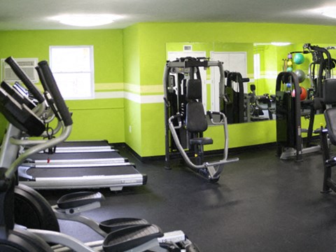 a gym with weights and other equipment in it