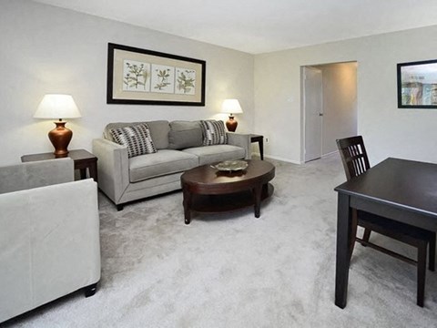 a living room with a couch and a table