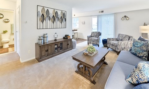 a living room with couches and a coffee table