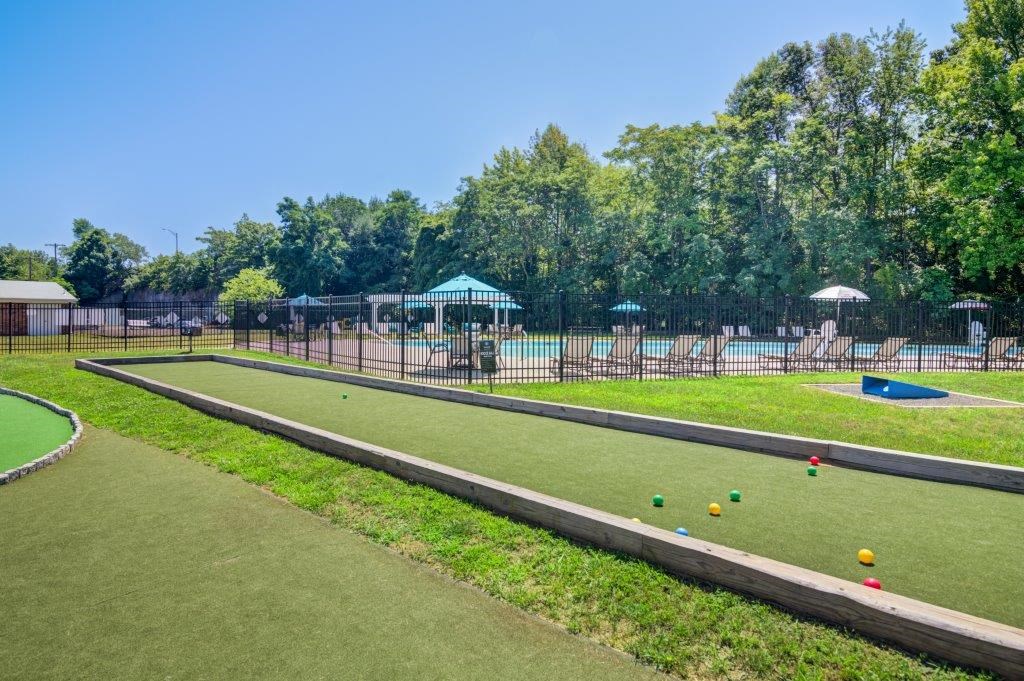 a park with a tennis court and a pool