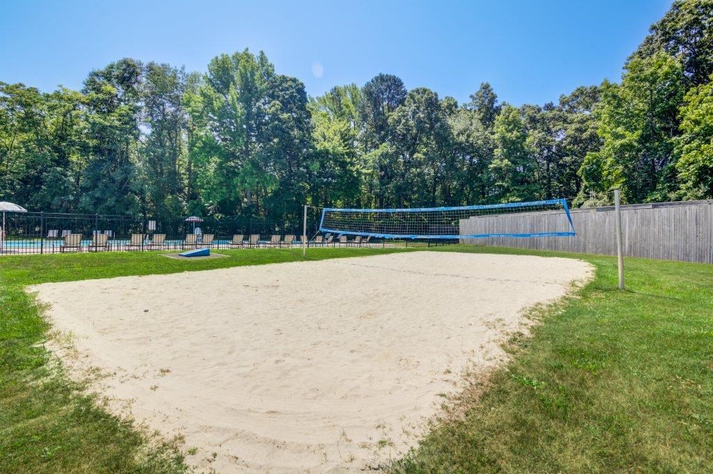 a volleyball court on the sand in a park