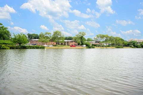 a view of a body of water with houses on the other side