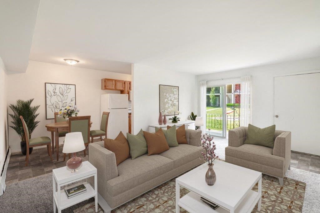 a living room and dining room with a couch and a table
