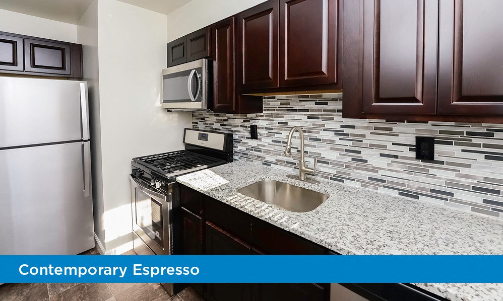 a kitchen with a sink and a refrigerator