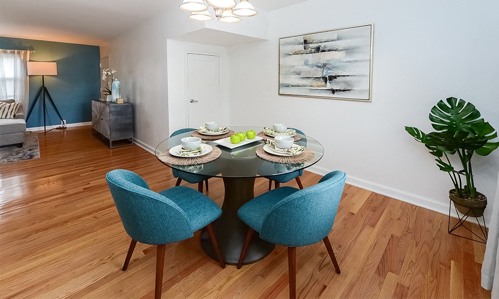 a dining room with a table and chairs
