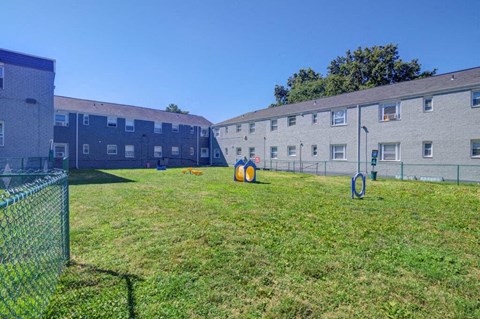 a large yard in front of some apartments