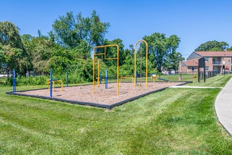 the park at the community is full of playground equipment