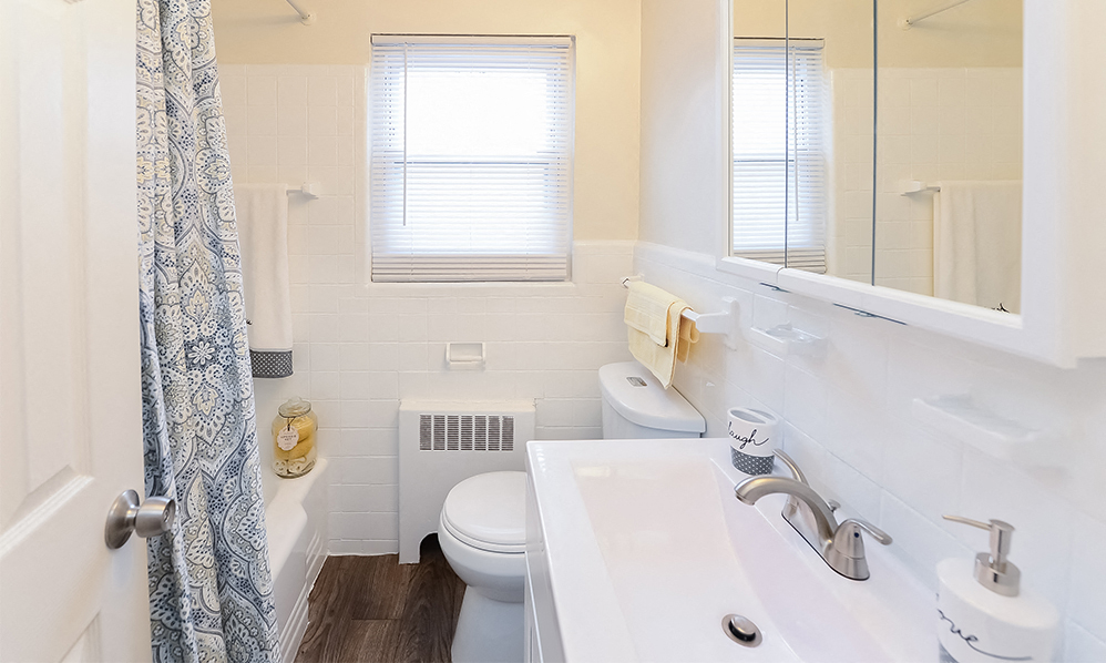 a bathroom with a sink toilet and a shower