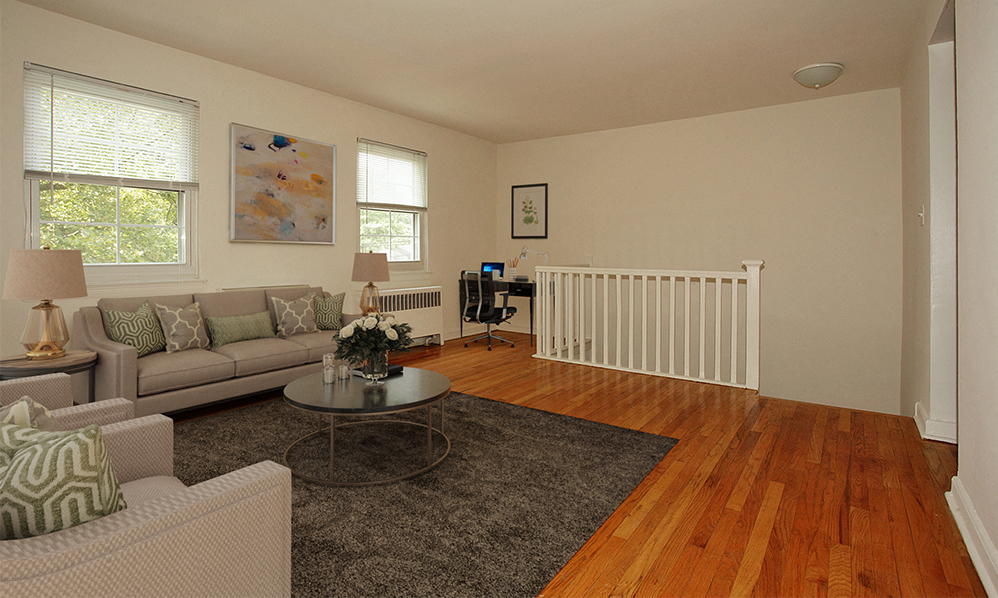 a living room with a couch and a table