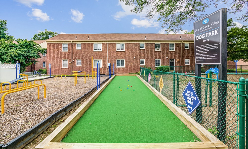 a miniature golf course in front of a brick building