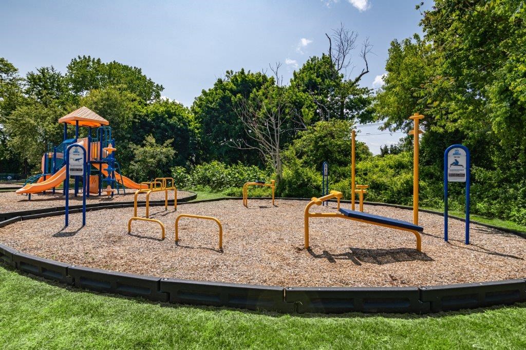 a playground on a sunny day in a park