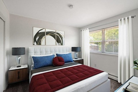 a bedroom with a bed and a window