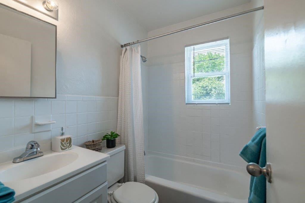 a bathroom with a sink toilet and a shower
