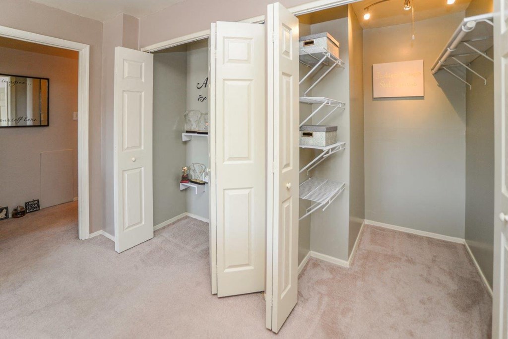 the walk in closet in the master bedroom is empty