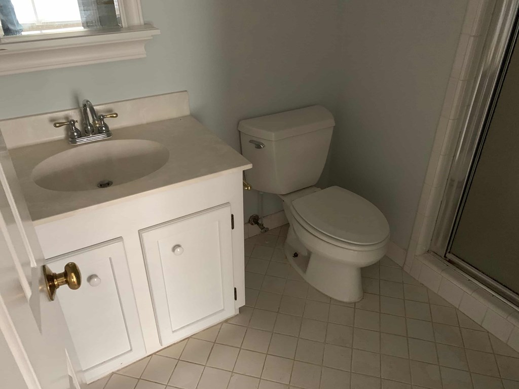 a bathroom with a toilet and a sink
