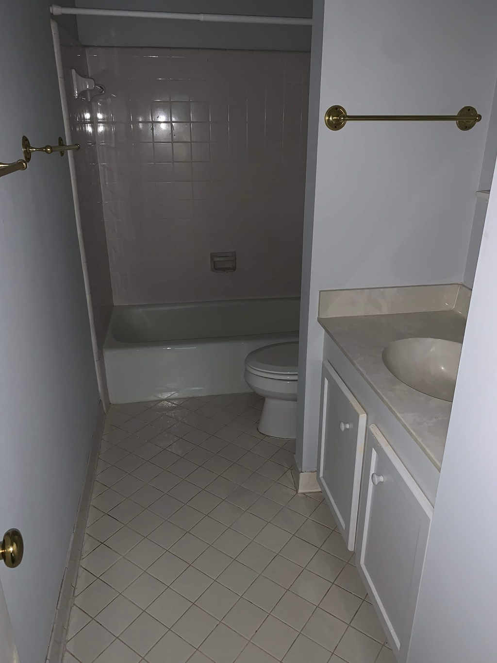 a bathroom with a toilet and a sink and a bath tub