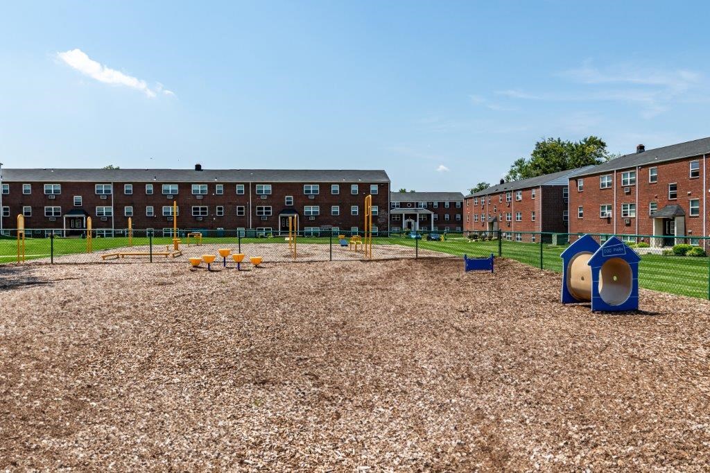 a playground in front of an apartment building