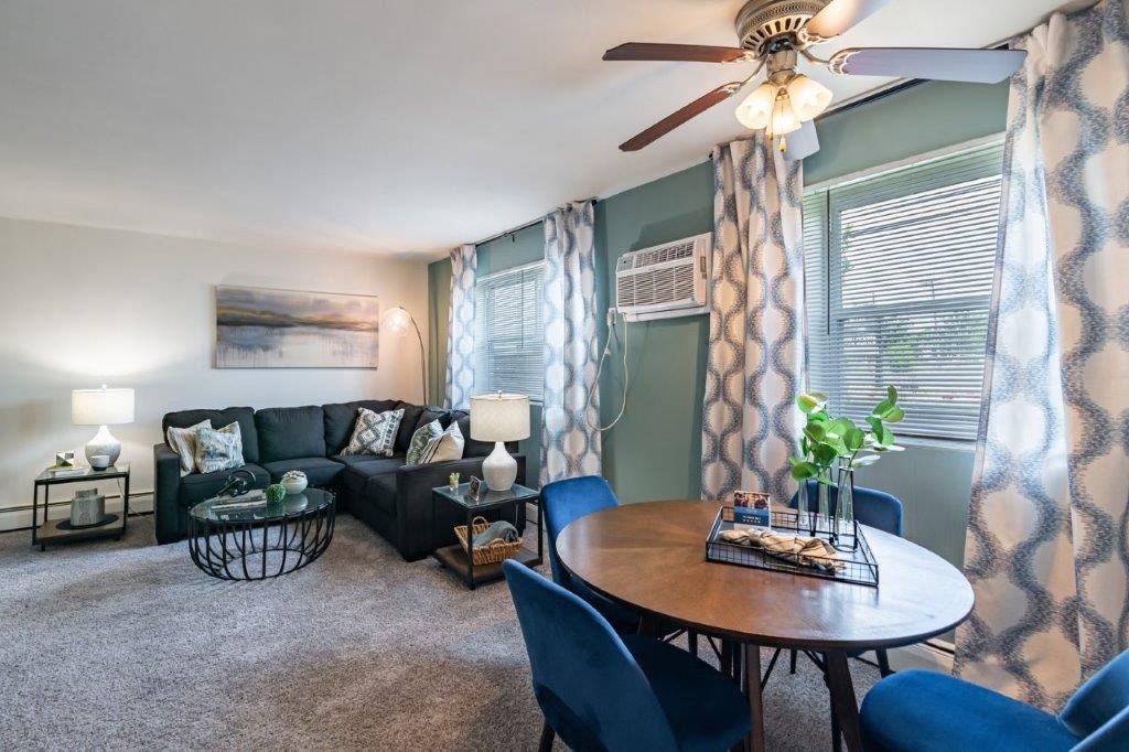 a living room with a table and a couch