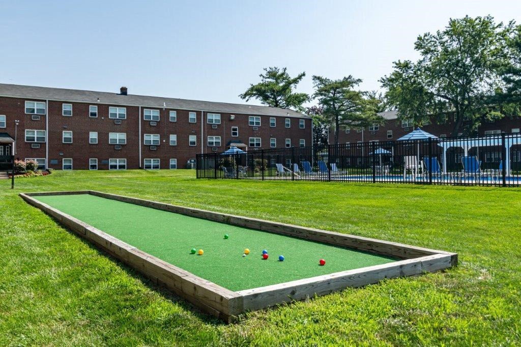 a game of bocce ball on a green field