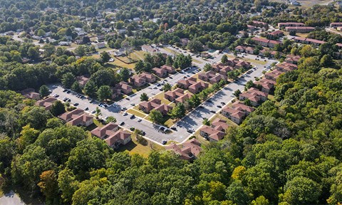 an aerial view of a neighborhood with houses and trees