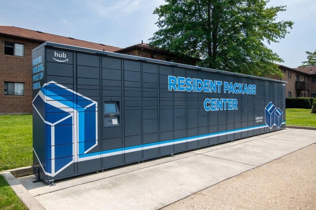 a small building with a sign on it on a sidewalk