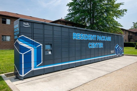 a small building with a sign on it on a sidewalk