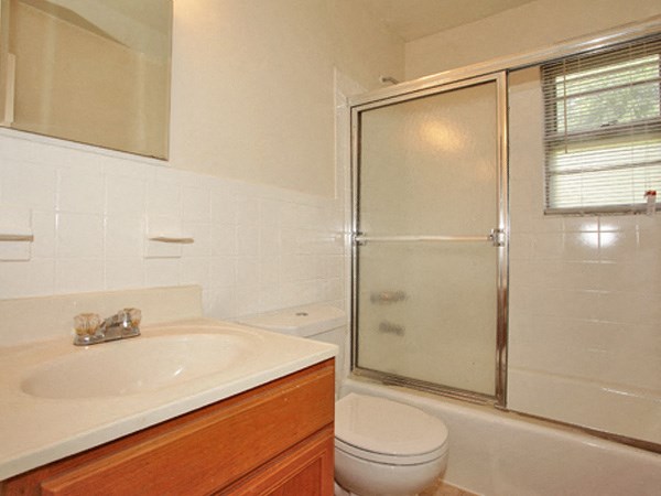 a bathroom with a sink toilet and a shower