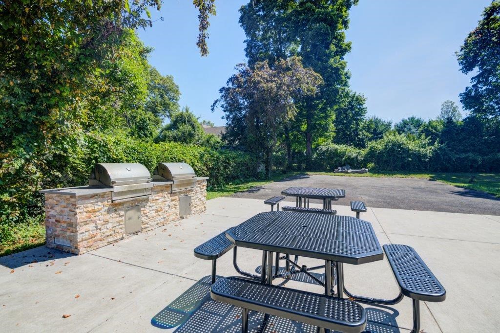 a picnic area with benches and a picnic table